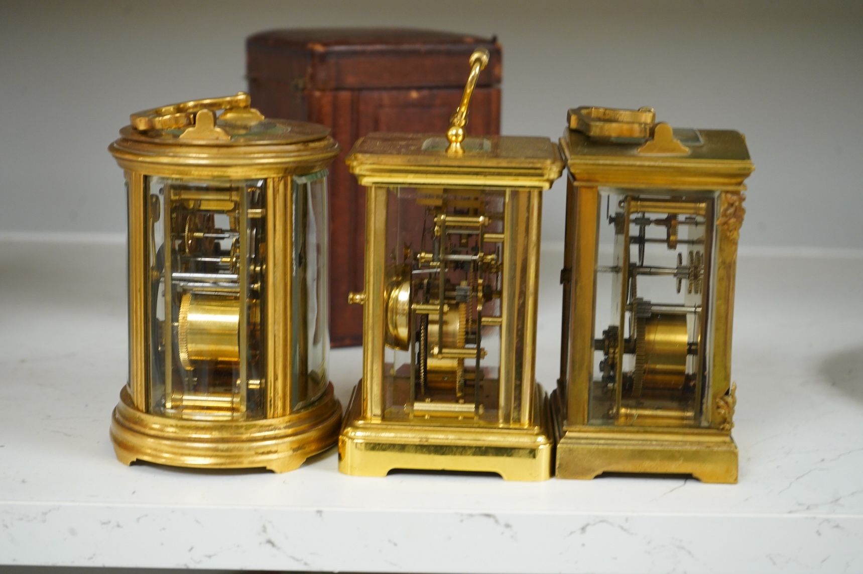 Two carriage clocks and a timepiece, tallest 12.5cm
